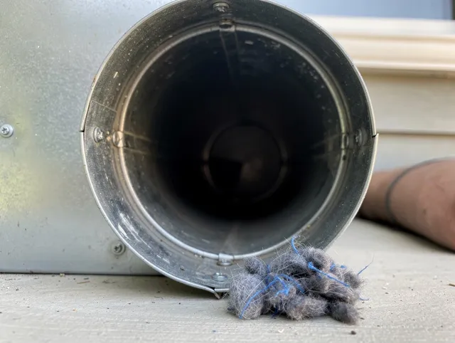 Hanson Dryer Vent Cleaning technician using specialized equipment to clear severe dryer vent blockage in Hanson